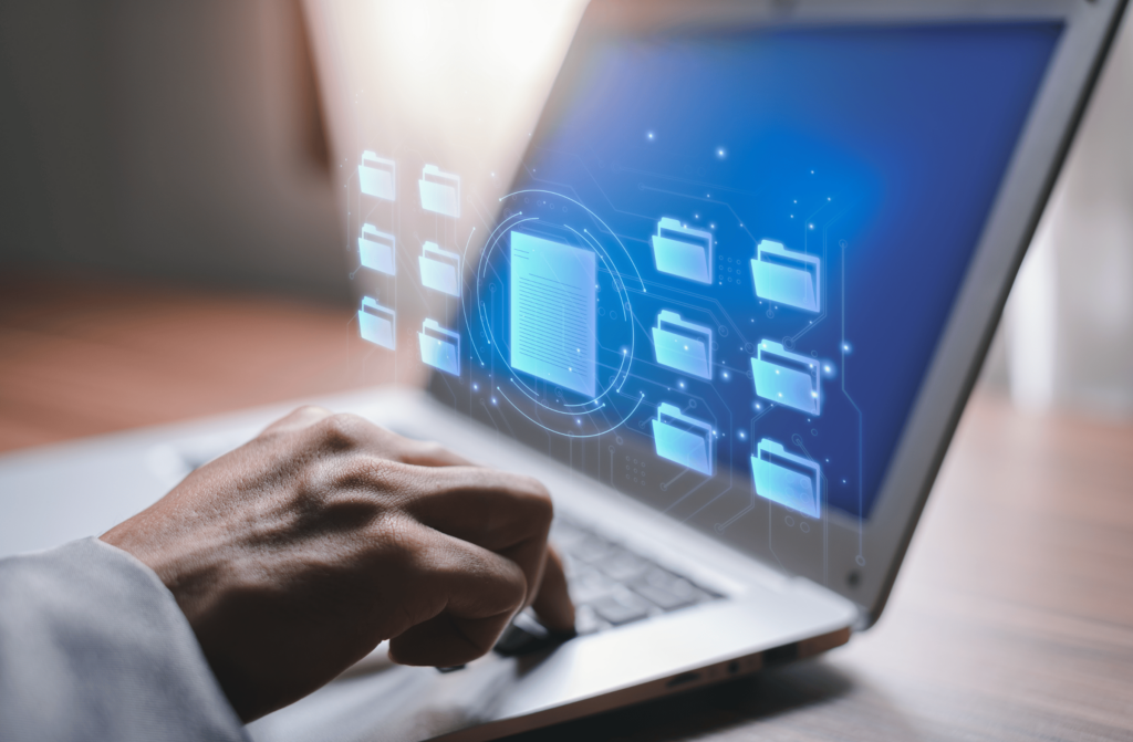 A caregiver uses technology and an electronic storage system to store and organize files.