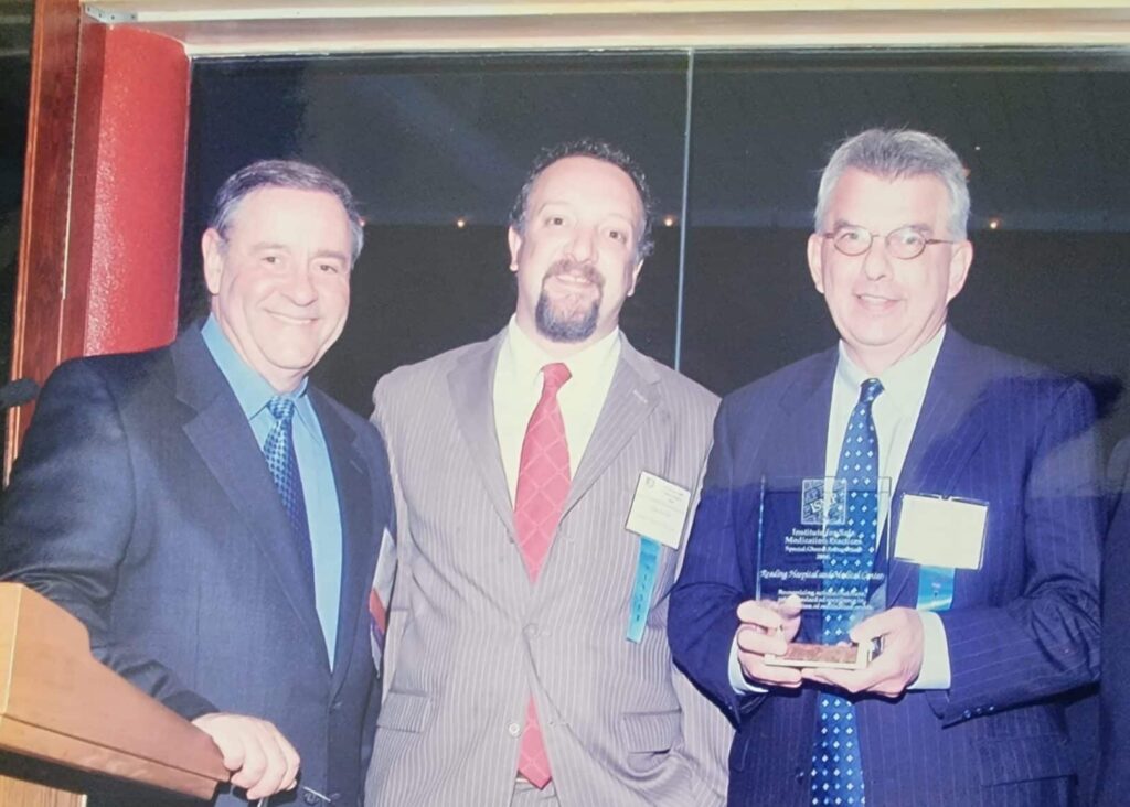 John and Chuck holding the Cheers Award.