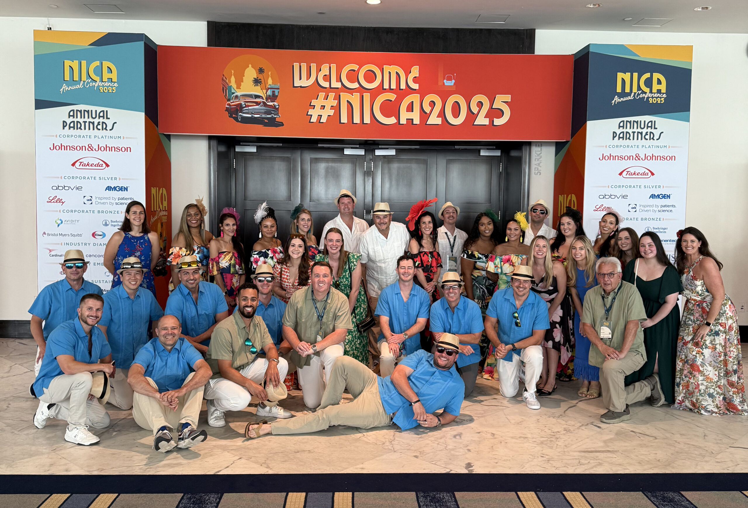 The WeInfuse & RxToolKit teams posed for a picture with client FloMed in front of the 2025 NICA Conference entrance.