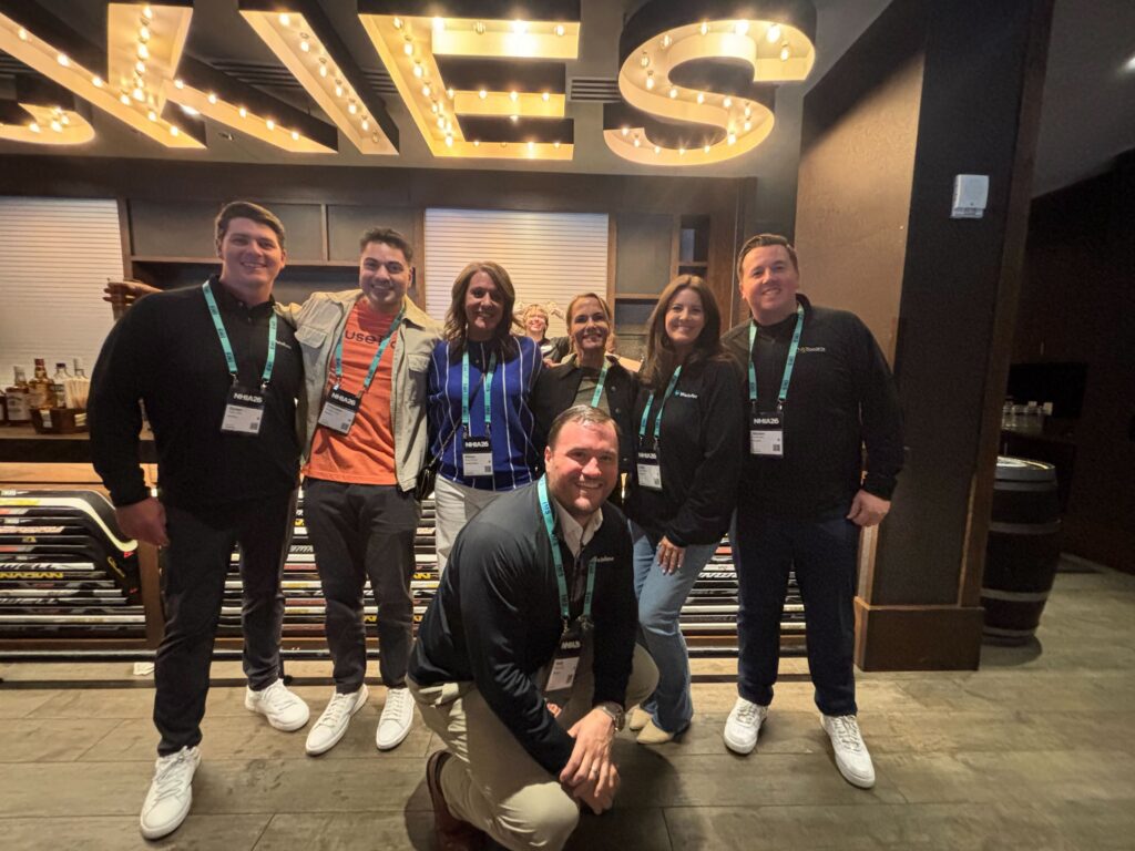 Members of the WeInfuse, RxToolKit, and InfuseTrack teams take a picture with industry friends at the Tennr & WeInfuse Happy Hour.