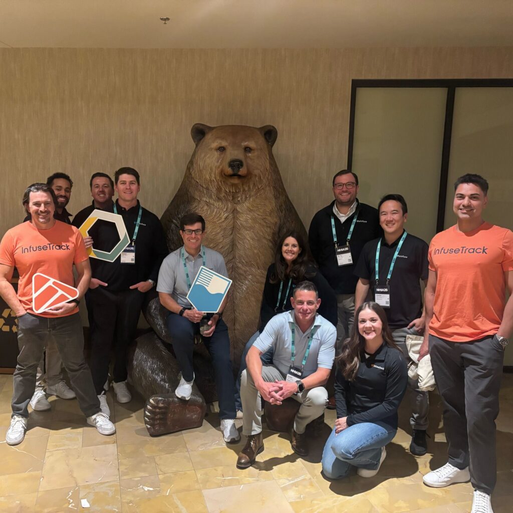 The WeInfuse, RxToolKit, and InfuseTrack teams taking a group picture at the 2026 NHIA Conference Happy Hour.