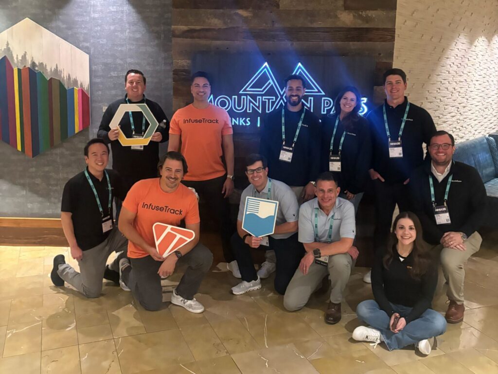 The WeInfuse, RxToolKit, and InfuseTrack teams take a group picture outside the Mountain Pass Sports Bar.