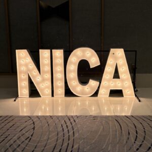 A light up sign spelling NICA.