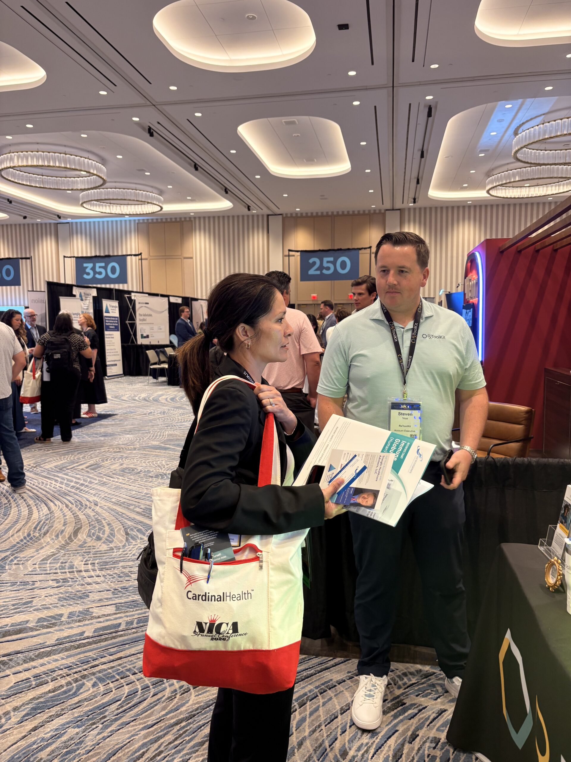 RxToolKit Account Executive Steven Nice speaks with an attendees inquiring about RxToolKit.